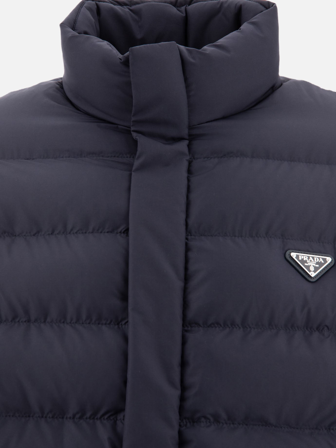 Down jacket with triangle logo